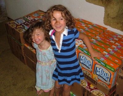 margot and lizzie helping with food bank